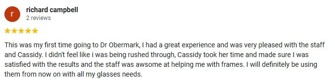 A 5-star Google review of Dr. Obermark Eye Health Care praising the patient and thorough care